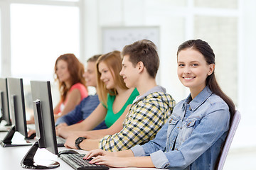 Image showing female student with classmates in computer class