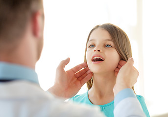 Image showing male doctor checks little girl lymph nodes