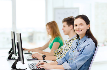 Image showing three smiling students in computer class