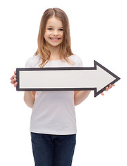 Image showing smiling girl with blank arrow pointing right