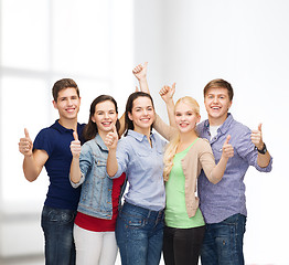 Image showing group of smiling students showing thumbs up