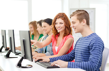 Image showing female student with classmates in computer class