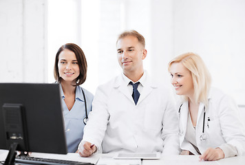 Image showing doctors looking at computer on meeting