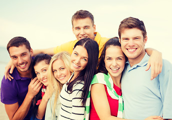 Image showing group of friends having fun on the beach