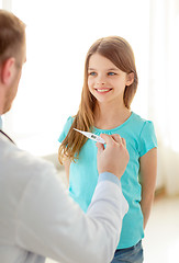 Image showing male doctor with child measuring temperature