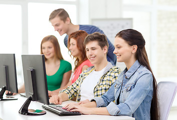 Image showing female student with classmates in computer class