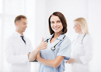 Image showing team of doctors showing thumbs up