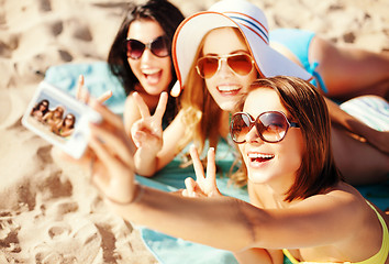 Image showing girls taking self photo on the beach