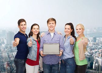 Image showing smiling students with laptop computer