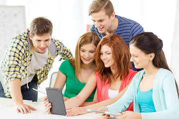 Image showing smiling students with tablet pc at school