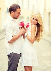 Image showing couple with flowers in the city