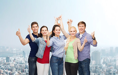 Image showing group of smiling students showing thumbs up