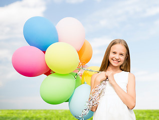 Image showing happy girl with colorful balloons