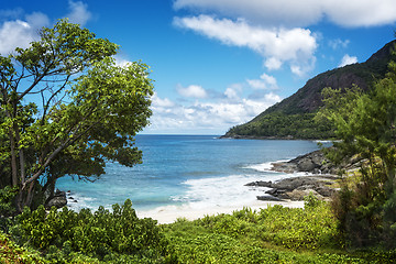 Image showing Small sandy beach between volcanic rocks