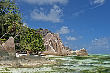 Image showing Stretch of  sandy beach between picturesque rock formations
