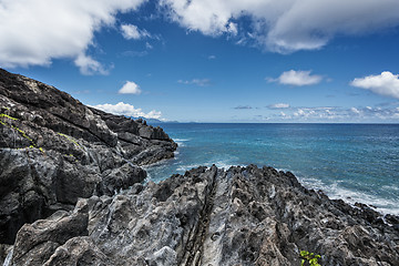 Image showing rocky shoreline of tropical volcanic island