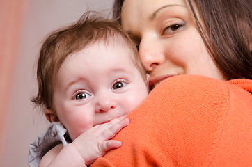 Image showing Six-month baby girl on hands happy mom