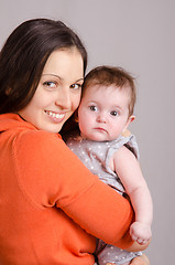 Image showing Happy mother hugging her daughter