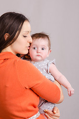 Image showing Happy mother kissing her daughter