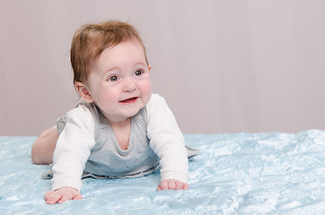 Image showing Six-month girl learning to crawl