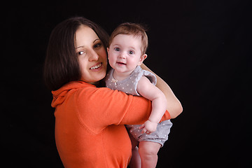 Image showing Portrait of six month baby on a mother hands