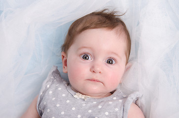 Image showing Portrait of a six-month girl lying in bed