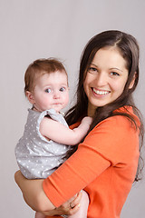 Image showing Young mother hugging her daughter