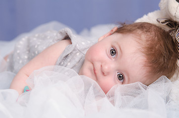 Image showing Baby girl lying on a fabric