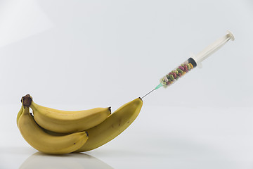 Image showing Banana and syringe with pills