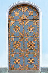 Image showing Vintage door with wrought ornament.