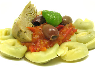 Image showing Tortellini  with tomato sauce, leaf of basil, olives and artichoke