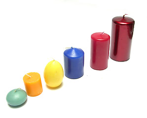 Image showing Six different coloured candles in a line