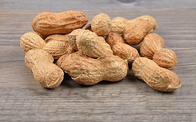 Image showing Peanuts on wood