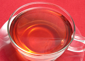 Image showing Tea cup with rose hip tea on a placemat
