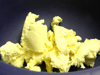 Image showing Pieces of margarine in a blue bowl