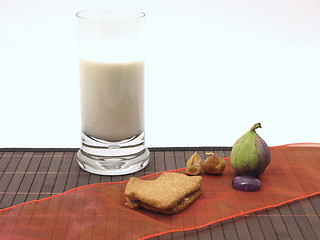 Image showing Selfmade christmas pastry with a glas of milk