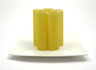Image showing Several canneloni standing on a white plate