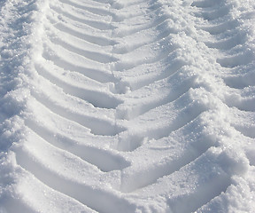 Image showing The skidmark of a tractor in the snow
