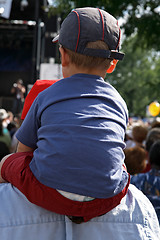 Image showing Boy sitting on the shoulders of his father