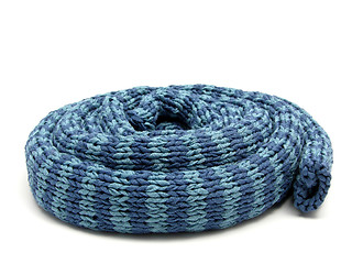 Image showing Blue striped  reeled up knitting scarf  on white