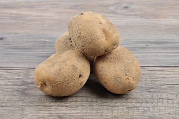 Image showing Potatoes on wood