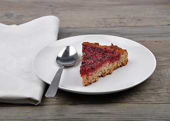 Image showing Red currant cake on wood