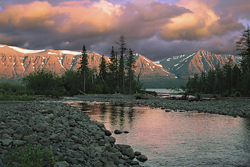 Image showing Sunset over river and mountains