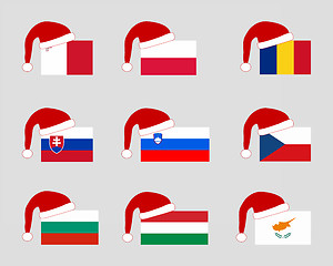 Image showing Flag of nine countries with Santa Claus cap