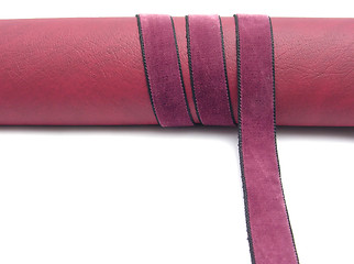 Image showing Rolled up leatherette with purple band