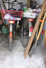 Image showing Three bicycles in a basement of a house