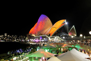 Image showing Crowds of locals and tourists enjoy Sydney Opera House Vivid Syd