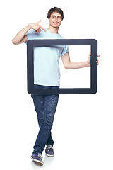 Image showing Full length man holding tablet frame