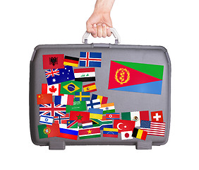 Image showing Used plastic suitcase with stickers