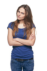 Image showing Young discontent girl with folded hands